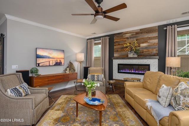 living room with ceiling fan, ornamental molding, wood-type flooring, and wood walls