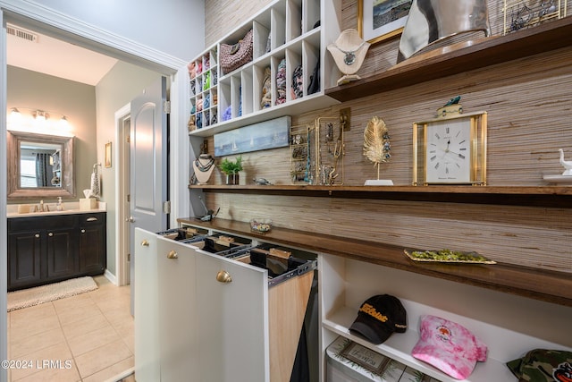 kitchen with light tile patterned flooring and sink