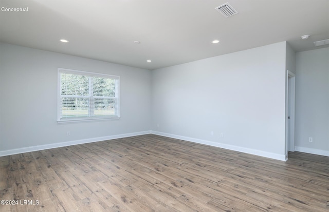 unfurnished room featuring light hardwood / wood-style floors