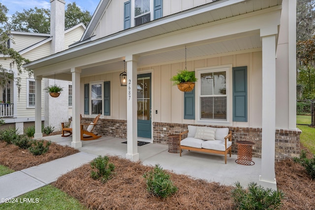 doorway to property featuring covered porch