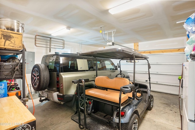 garage featuring a garage door opener and refrigerator