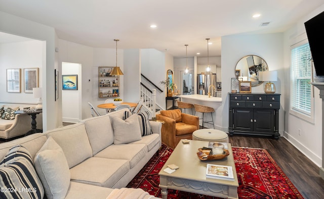 living room featuring dark hardwood / wood-style flooring