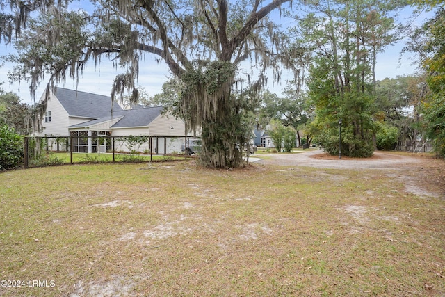 view of yard featuring a sunroom