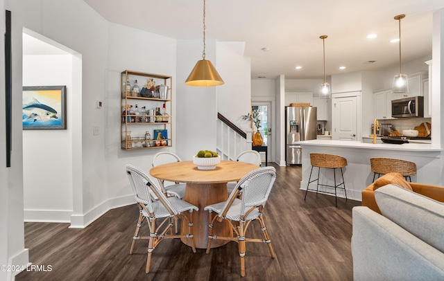 dining space featuring dark hardwood / wood-style flooring