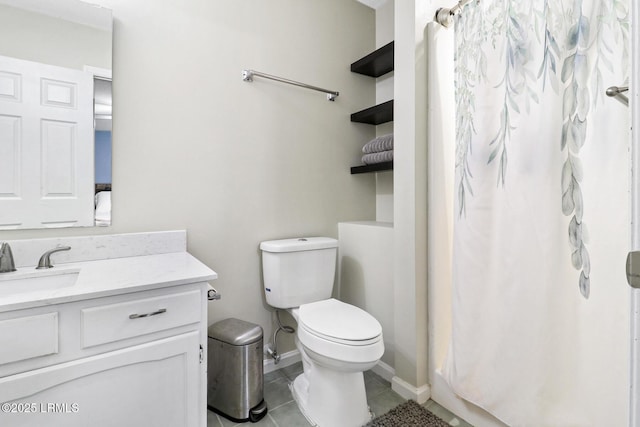 full bath featuring toilet, vanity, a shower with curtain, baseboards, and tile patterned floors