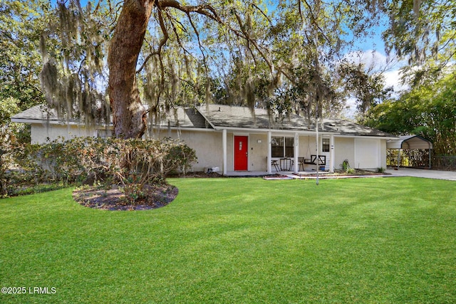 view of front facade featuring a front yard and stucco siding