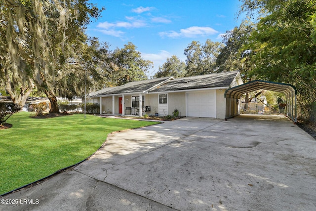 ranch-style house featuring a front yard, concrete driveway, an attached garage, and a detached carport