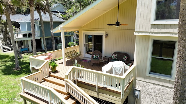 129 Sea Otter Ln, Fripp Island, SC 29920 - wooden terrace with ceiling fan, stairway, and a lawn