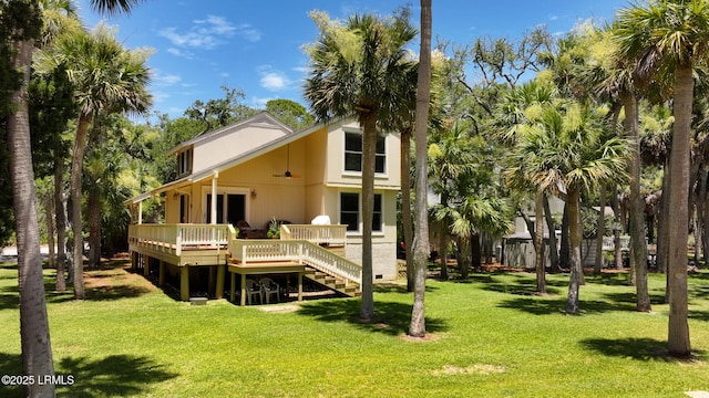 129 Sea Otter Ln, Fripp Island, SC 29920 - back of property featuring a wooden deck and a yard