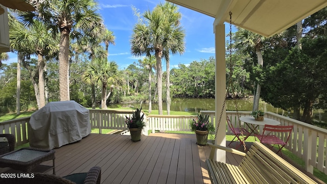 129 Sea Otter Ln, Fripp Island, SC 29920 - wooden terrace with a water view, grilling area, and view of wooded area
