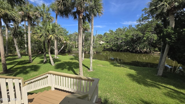 129 Sea Otter Ln, Fripp Island, SC 29920 - view of grassy yard featuring a deck with water view