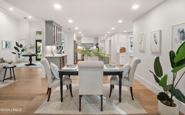 dining room featuring light hardwood / wood-style floors and a wealth of natural light