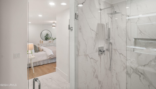 bathroom featuring wood-type flooring and a shower with shower door