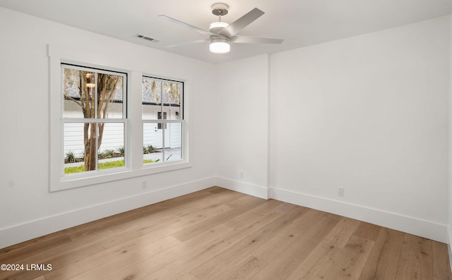 empty room featuring ceiling fan and light wood-type flooring