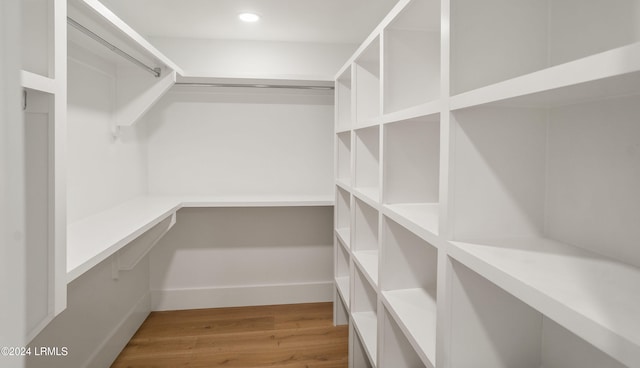 spacious closet featuring light wood-type flooring