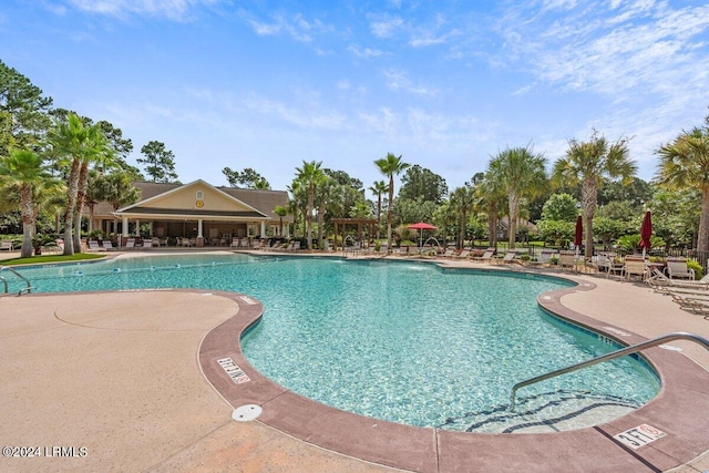 view of pool featuring a patio