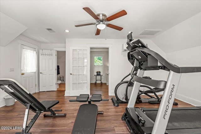 exercise area with a healthy amount of sunlight, dark wood-type flooring, ceiling fan, and french doors