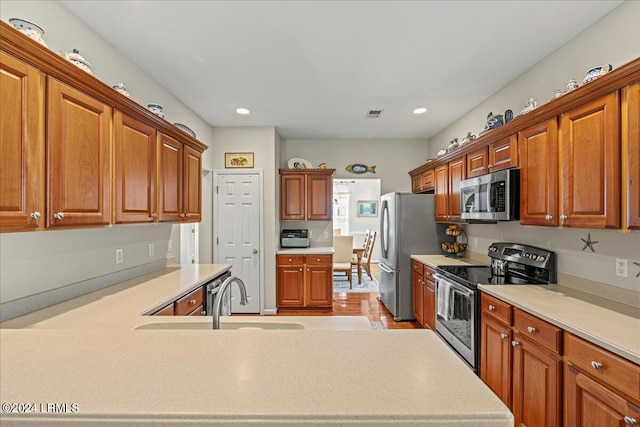 kitchen featuring stainless steel appliances and sink