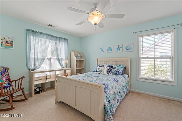 carpeted bedroom with ceiling fan