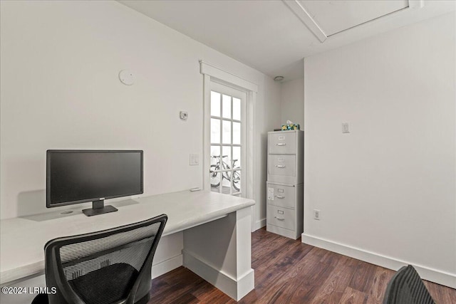 home office with dark wood-type flooring