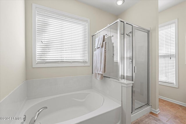 bathroom featuring independent shower and bath and tile patterned floors