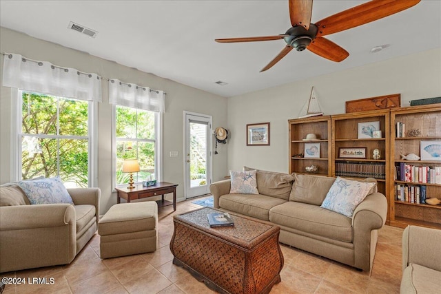 tiled living room featuring ceiling fan