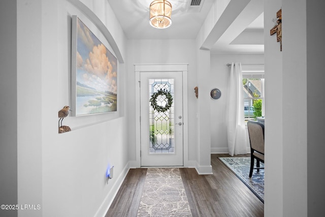 276 Monument St, Ridgeland, SC 29936 - foyer entrance with a chandelier, dark wood-style flooring, and baseboards