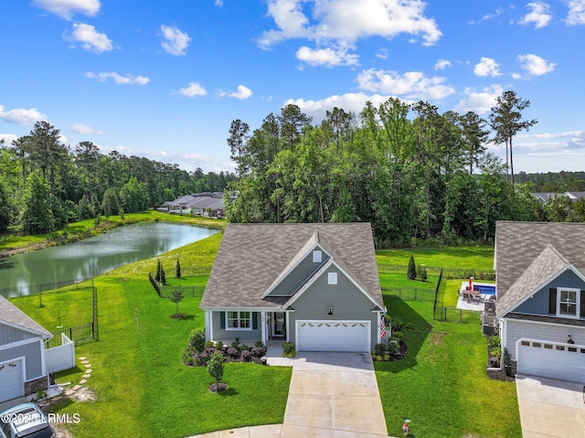 276 Monument St, Ridgeland, SC 29936 - view of front of property featuring a water view, driveway, a shingled roof, and a garage