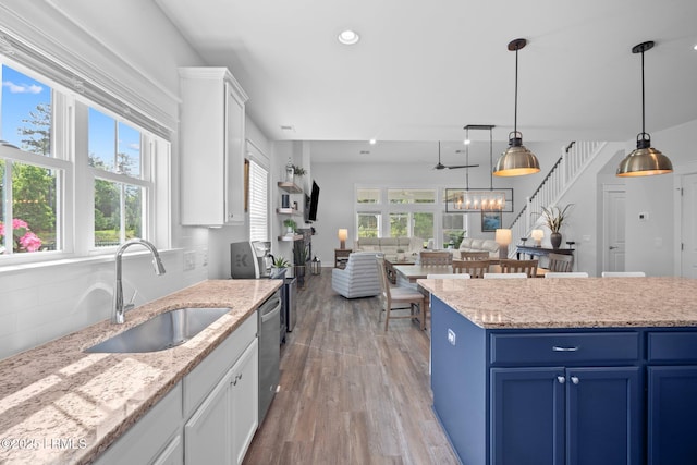 276 Monument St, Ridgeland, SC 29936 - kitchen with a sink, blue cabinets, dishwasher, healthy amount of natural light, and recessed lighting