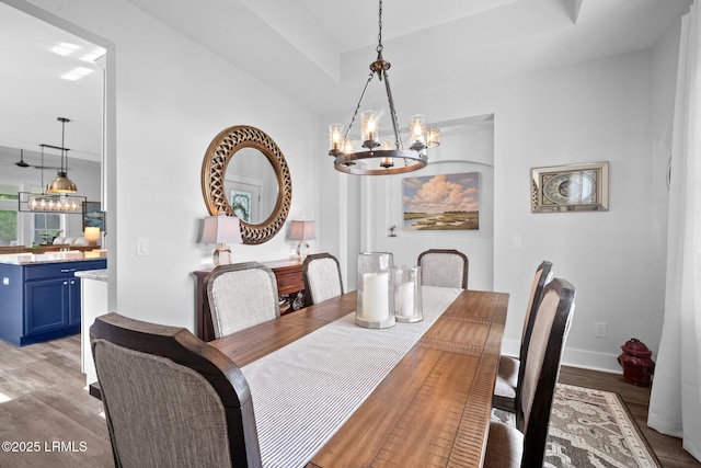 276 Monument St, Ridgeland, SC 29936 - dining room featuring a chandelier, light wood-style flooring, and baseboards