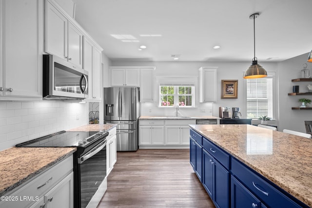 276 Monument St, Ridgeland, SC 29936 - kitchen featuring stainless steel appliances, a sink, white cabinetry, blue cabinetry, and recessed lighting
