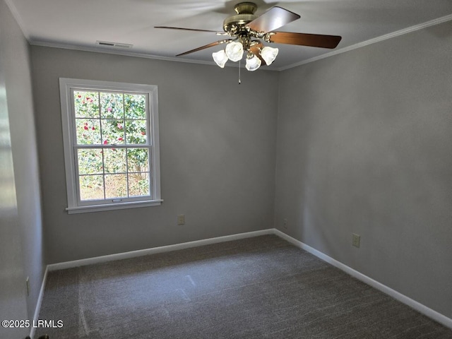 empty room with ornamental molding and carpet flooring