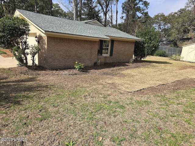 view of home's exterior with a lawn