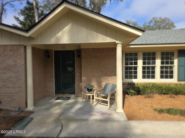 doorway to property with a patio area