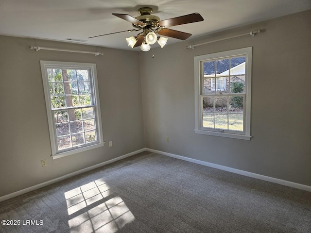 spare room with ceiling fan and carpet flooring