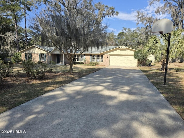 ranch-style house featuring a garage