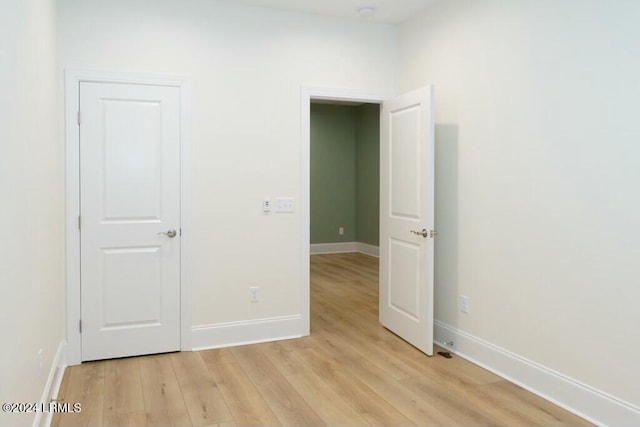 spare room with light hardwood / wood-style flooring