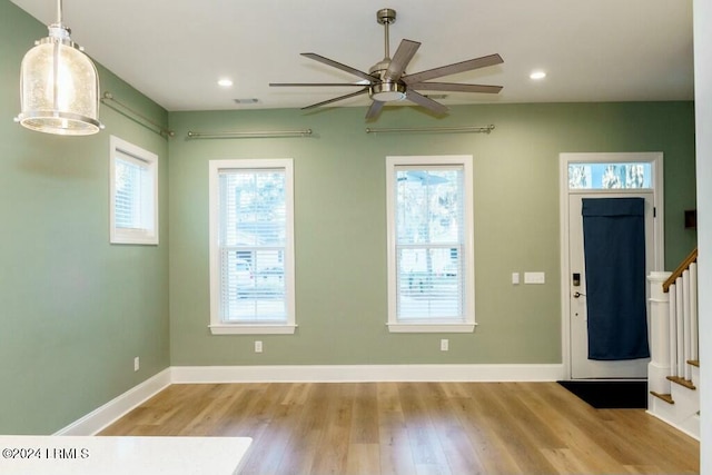 entrance foyer with ceiling fan, light hardwood / wood-style floors, and a healthy amount of sunlight