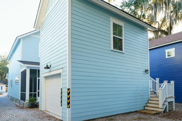 view of property exterior featuring a garage