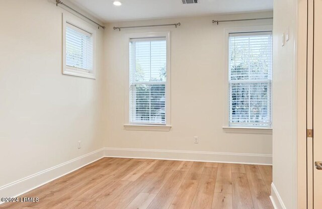 spare room featuring light hardwood / wood-style floors