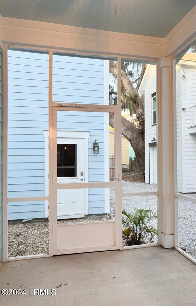 doorway to outside featuring concrete flooring