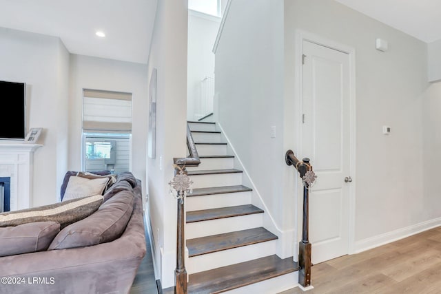 stairway featuring hardwood / wood-style flooring