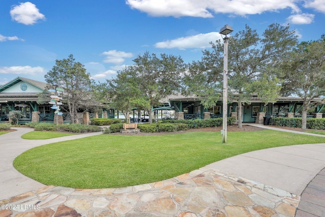 view of home's community with a lawn