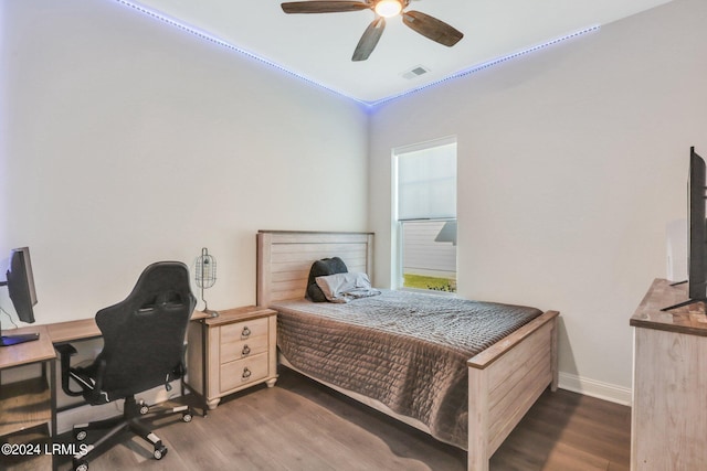 bedroom featuring dark wood-type flooring and ceiling fan