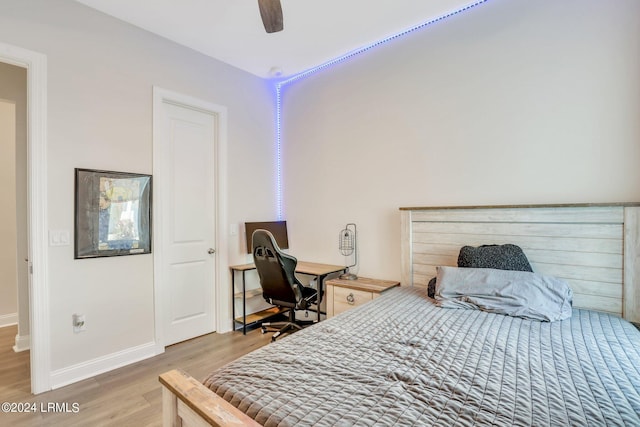 bedroom with light hardwood / wood-style floors and ceiling fan