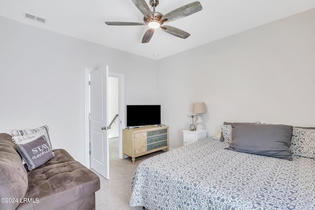 bedroom featuring ceiling fan and light carpet