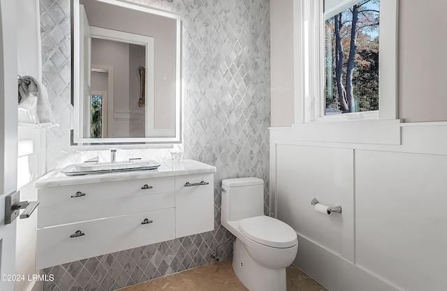 bathroom with vanity and toilet