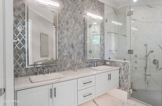 bathroom with vanity and a shower with shower door