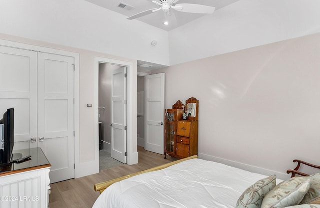 bedroom with a closet, ceiling fan, and light wood-type flooring