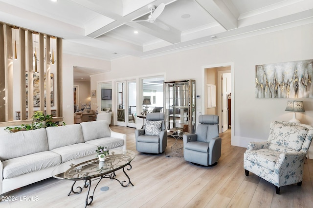 living room featuring french doors, coffered ceiling, ornamental molding, beamed ceiling, and light hardwood / wood-style floors